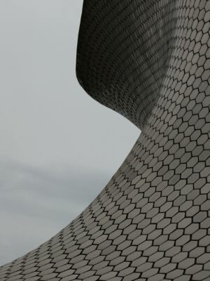 Close-up view of Museo Soumaya's futuristic hexagonal facade design.